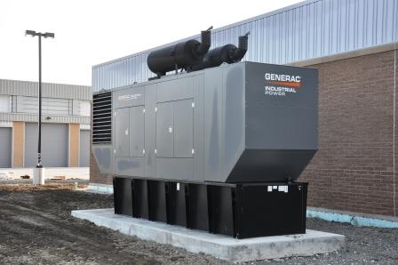 A large industrial Generac power generator, installed outdoors on a concrete pad next to a brick building, showcases the reliability of professional generator services. A warehouse and light post are visible in the background.